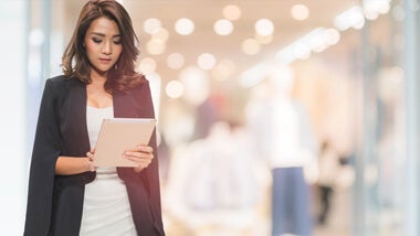 Asian business woman using tablet Asian business woman using tablet