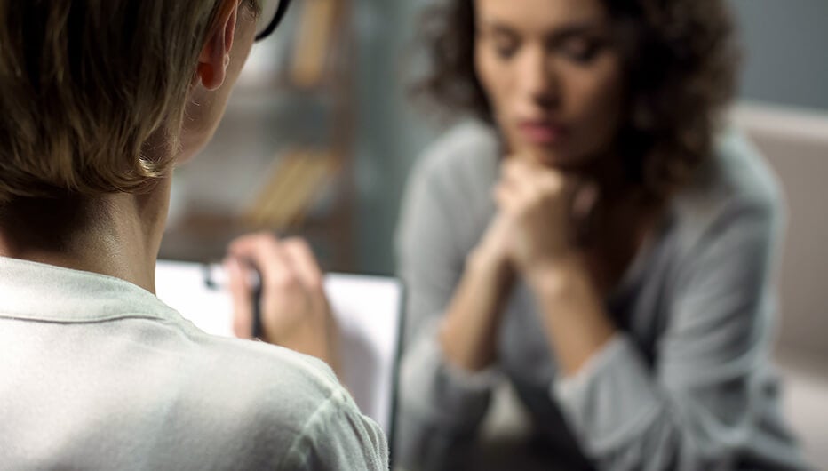 woman taking notes