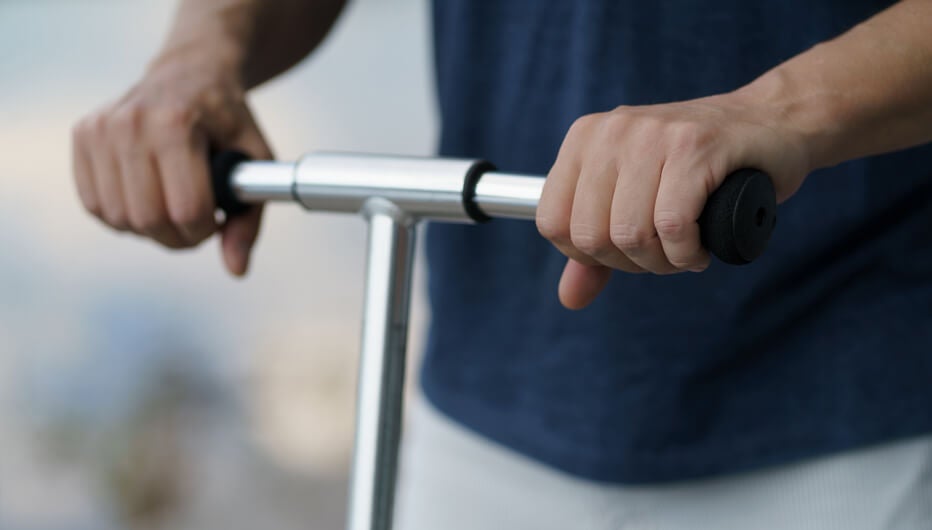 man holding scooter bars